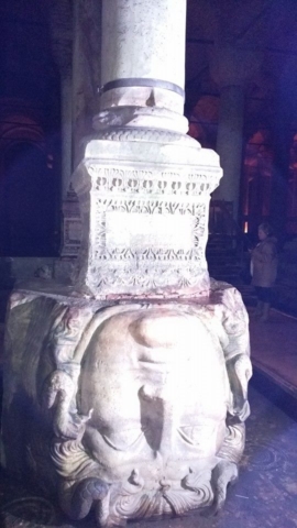 Upside down Medusa head statue inside Basilica Cistern