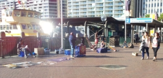 Buskers at Sydney harbour, playing Aboriginal music.