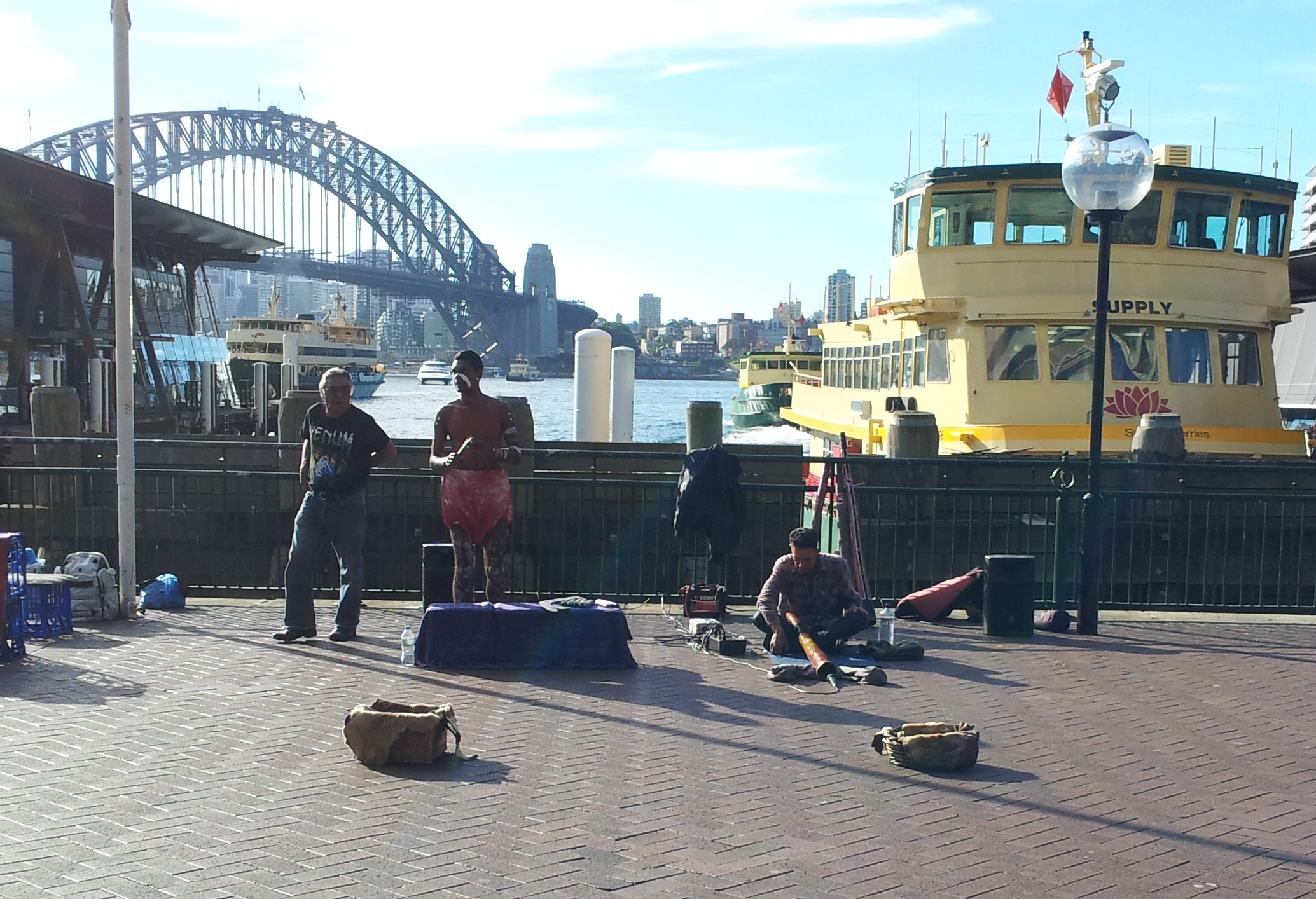 Buskers at Sydney harbour, playing Aboriginal music.