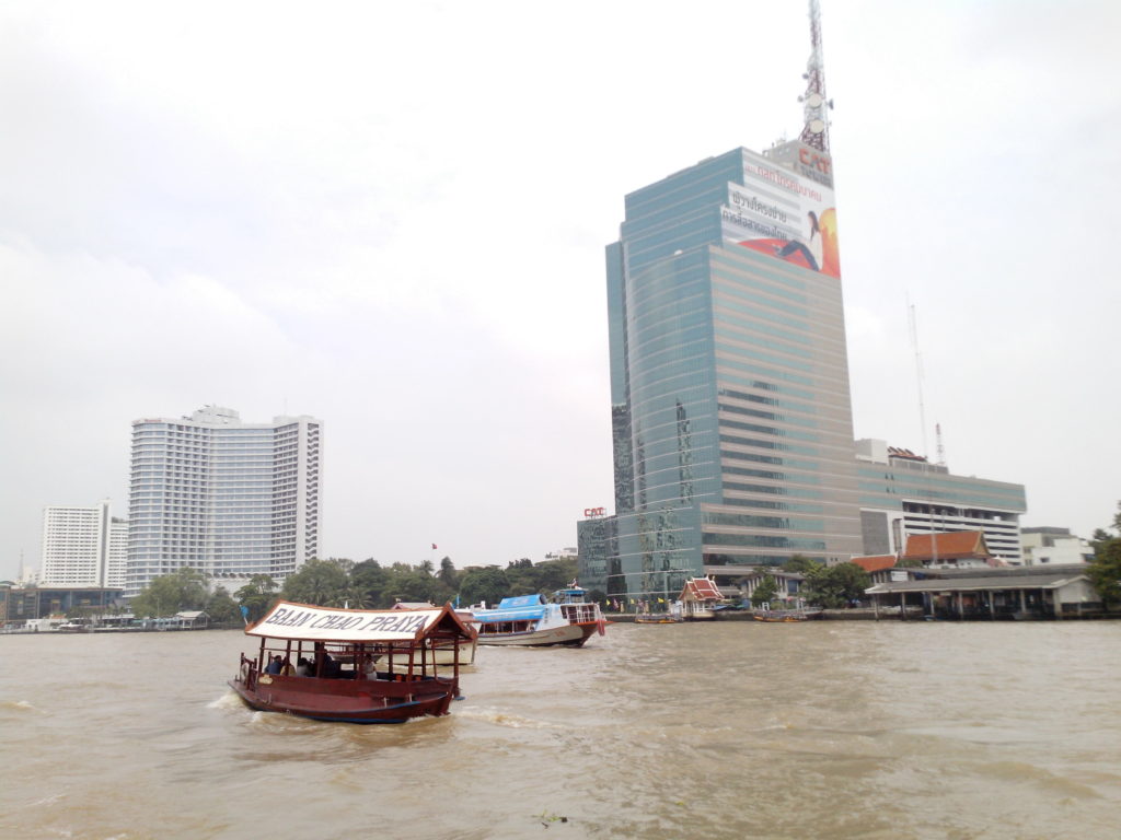 Chao Phraya river - CAT Tower next to the Sheraton Hotel.